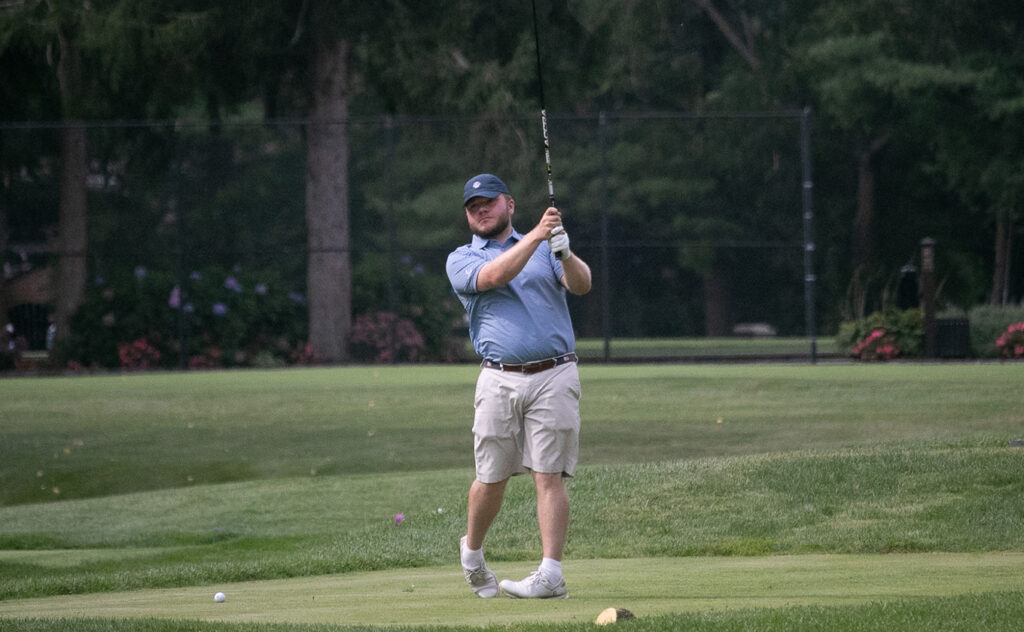 Nick Rhoden tees off during the 2024 LICSF Golf Marathon at Brookville Country Club