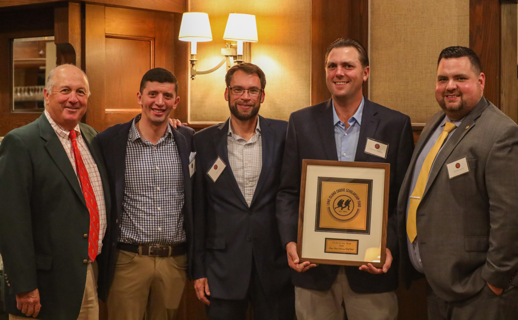 Long Island Country Club accepts 2024 Club of the Year award.